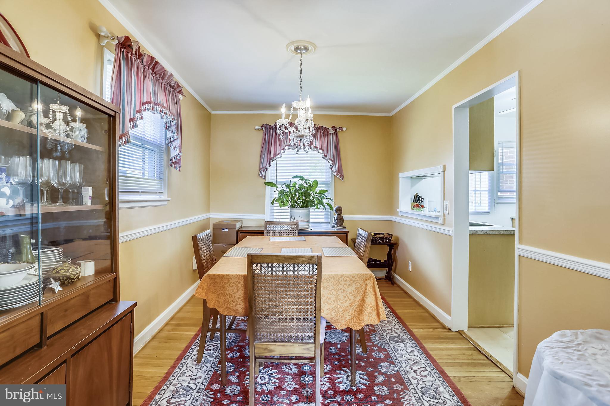 3115 Medway Street Silver Spring, MD 20902 - Photo 8 of 43 a view of a dining room with furniture window and wooden floor