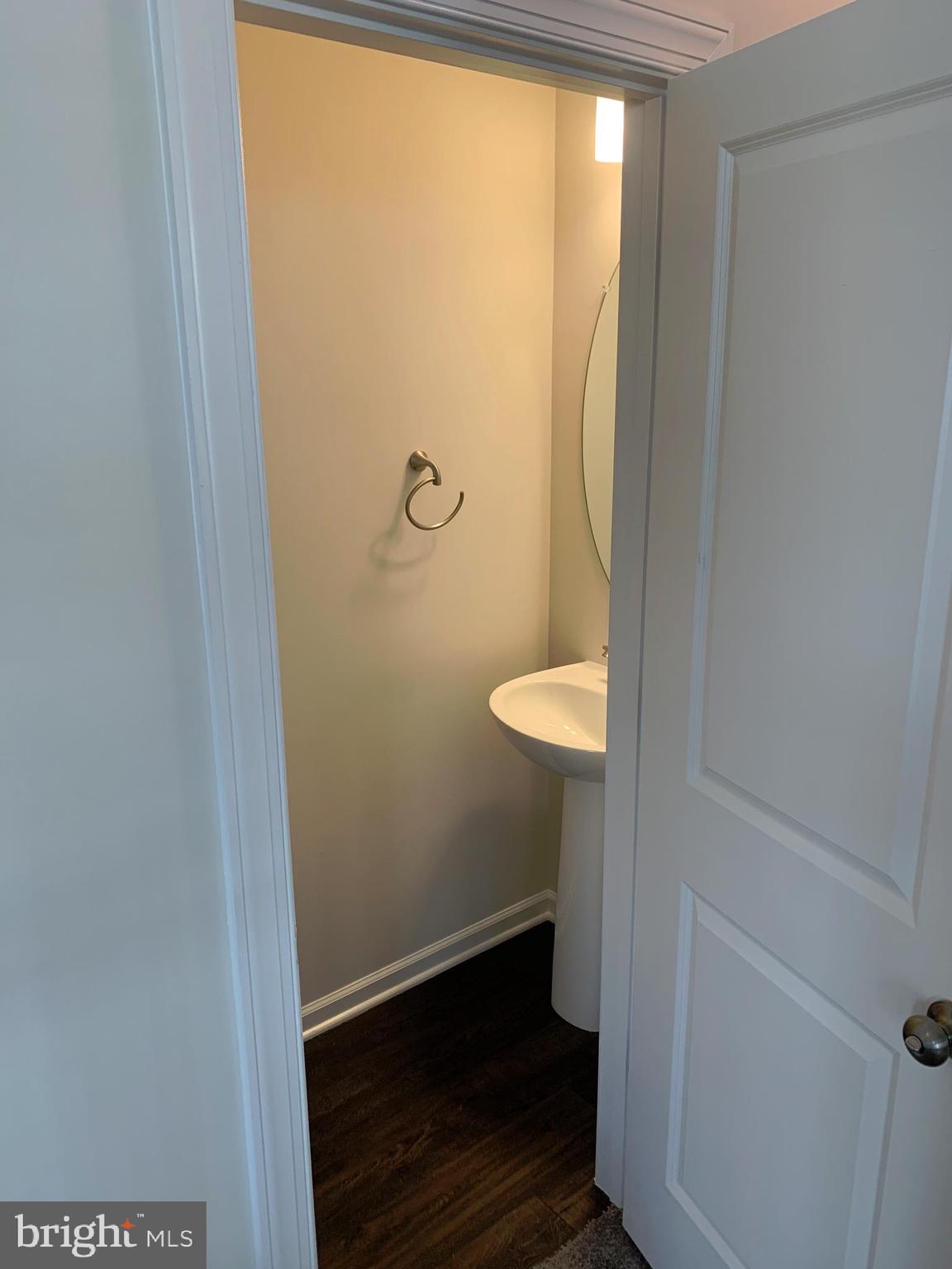 7112 McHenry Mews Frederick, MD 21703 - Photo 24 of 27 a bathroom with a sink and a toilet