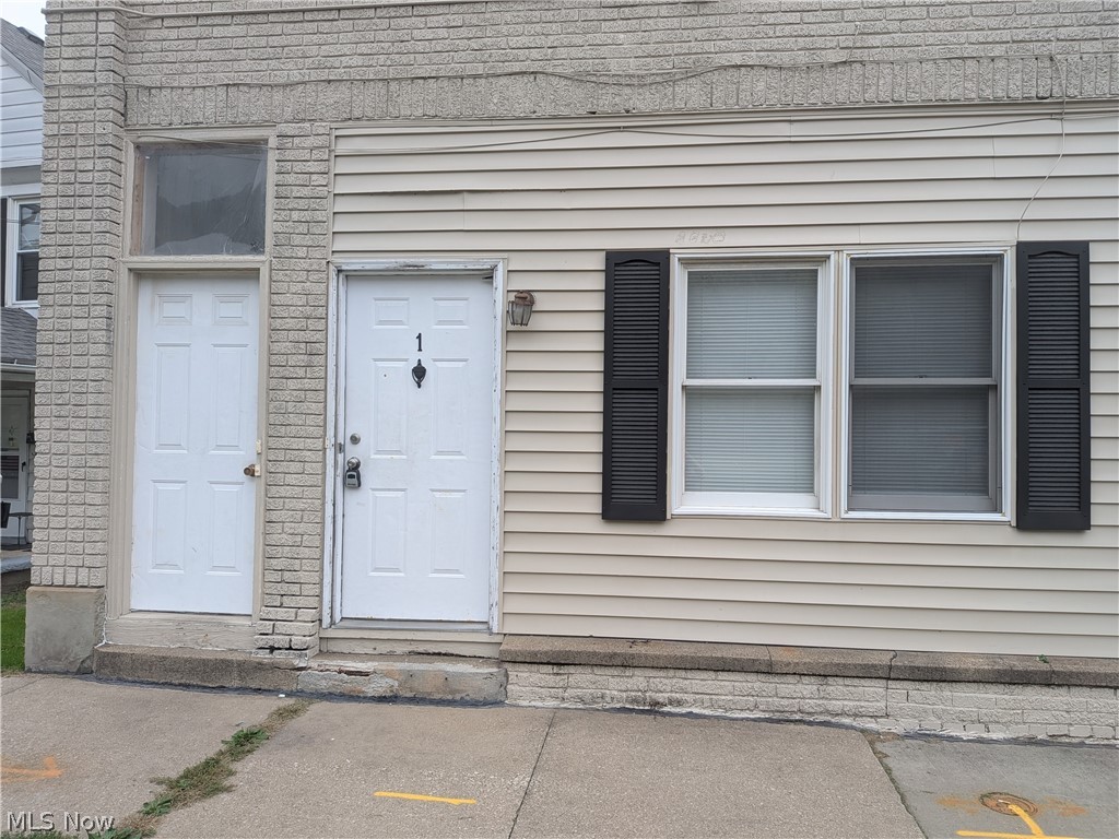 1881 Manchester Road, Unit 1 Akron, OH 44314 - Photo 44 of 44 1881 Manchester Rd, Akron, OH 44314 Unit #1 ground floor access and living. Welcome to this spacious 2-bedroom, 1-bathroom first-floor generous and remodeled apartment in the Kenmore neighborhood of Akron, offering a great amount of comfortable living space. This move-in ready apartment features LVP flooring throughout, a spacious living room, room for dining, separate kitchen with a gas range and stainless steel refrigerator, two bedrooms, and a full private bathroom which has a convenient step-in shower. Large windows provide natural light, while ample closets offer plenty of storage. Enjoy off-street parking and a backyard with a picnic table and small firepit, providing a pleasant outdoor space to relax and enjoy for the buildings tenants.
