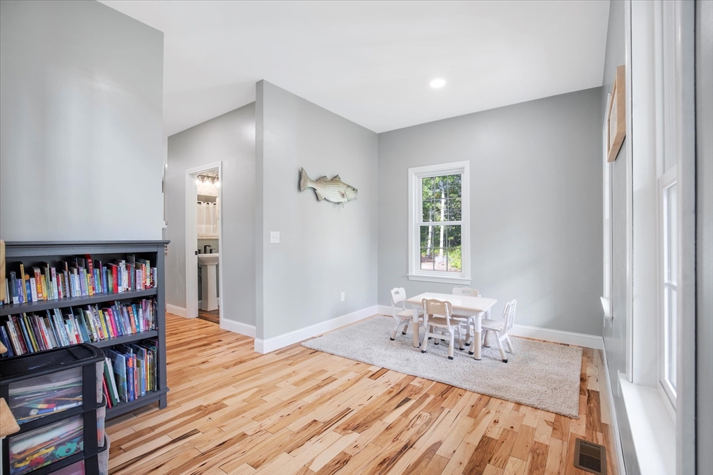 23 Pimlico Pond Road Mashpee, MA 02649 - Photo 11 of 42 a dining room with furniture and a book shelf