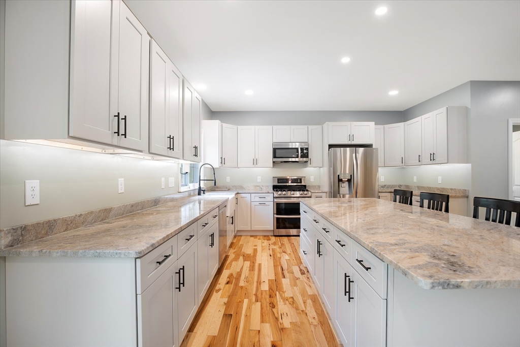 23 Pimlico Pond Road Mashpee, MA 02649 - Photo 15 of 42 a large kitchen with cabinets