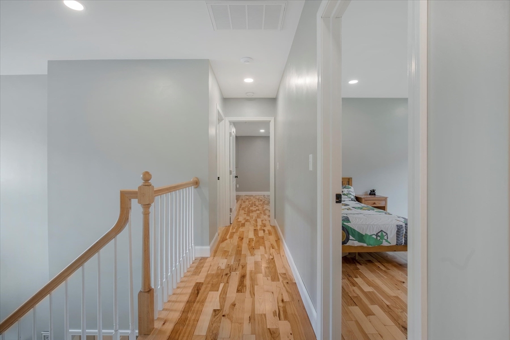 23 Pimlico Pond Road Mashpee, MA 02649 - Photo 19 of 42 a view of a hallway with wooden floor and staircase