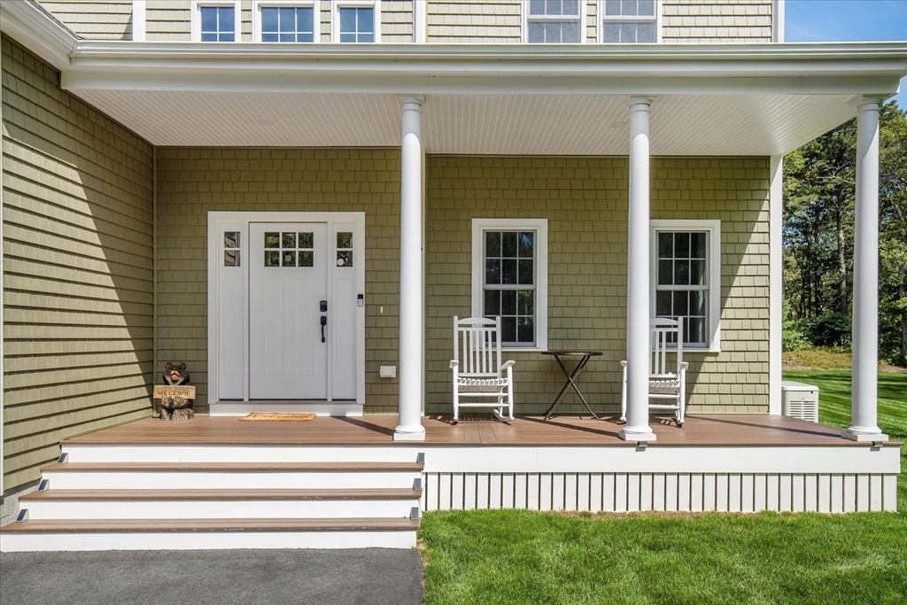 23 Pimlico Pond Road Mashpee, MA 02649 - Photo 2 of 42 a view of a house with a small yard and wooden floor and fence