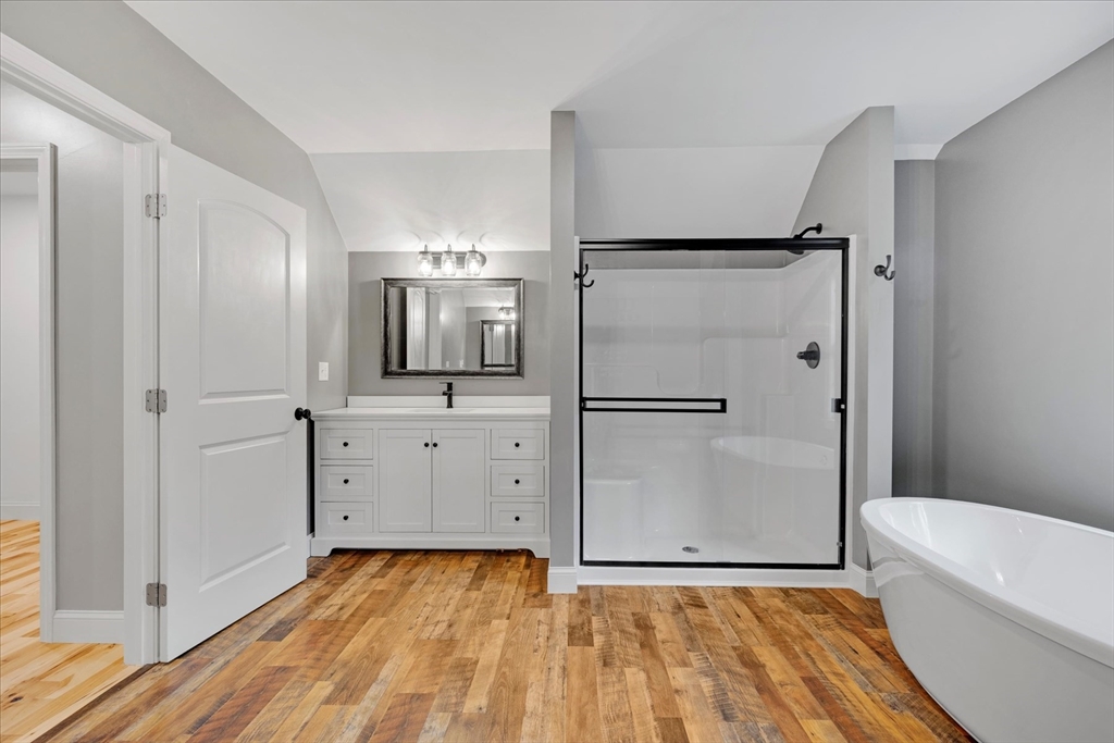 23 Pimlico Pond Road Mashpee, MA 02649 - Photo 28 of 42 a bathroom with a tub and shower