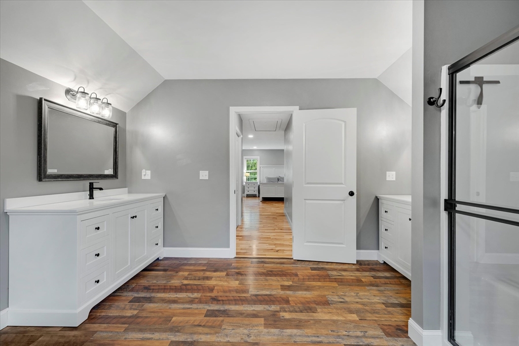 23 Pimlico Pond Road Mashpee, MA 02649 - Photo 29 of 42 a view of a hallway with wooden floor windows and a bathroom
