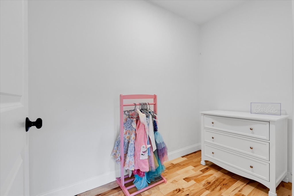 23 Pimlico Pond Road Mashpee, MA 02649 - Photo 32 of 42 a view of walk in closet with clothes