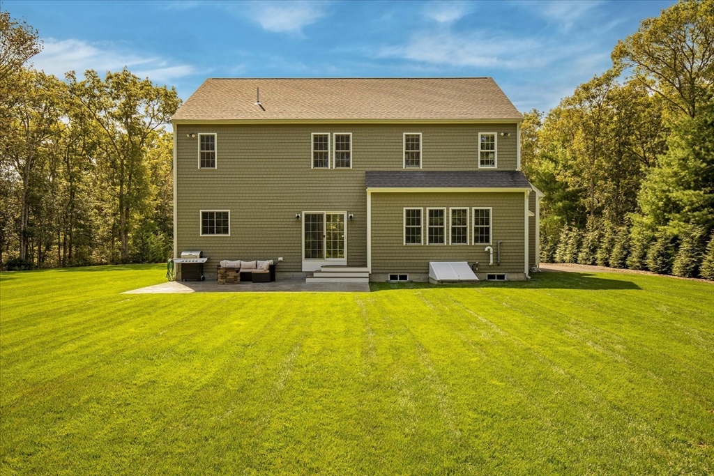23 Pimlico Pond Road Mashpee, MA 02649 - Photo 38 of 42 front view of a house with a swimming pool