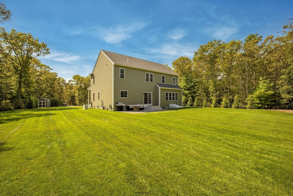 23 Pimlico Pond Road Mashpee, MA 02649 - Photo 40 of 42 a house view with swimming pool in front of it