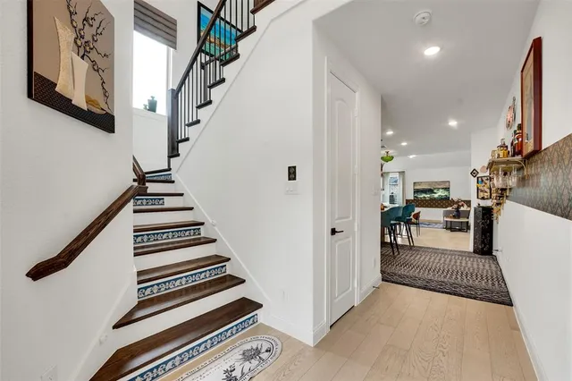 a view of a kitchen with furniture and staircase