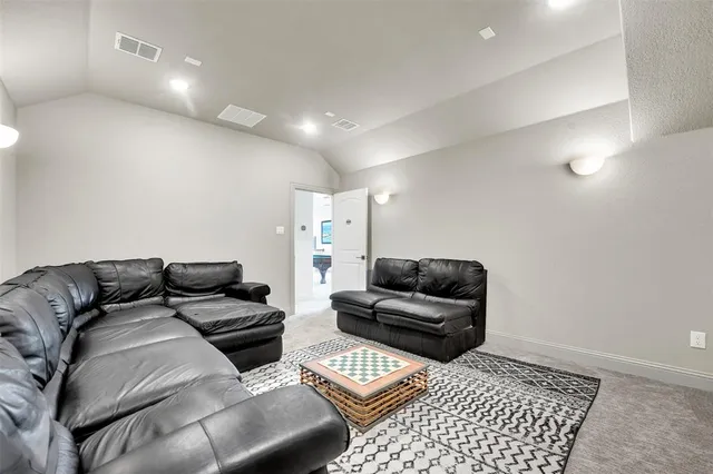 a living room with furniture and a rug