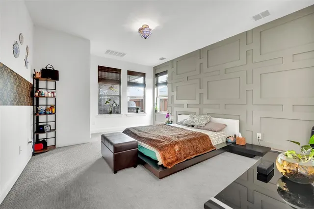 a bedroom with bed and window