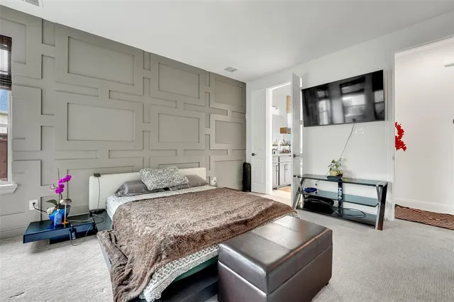 a bedroom with a bed and a couch