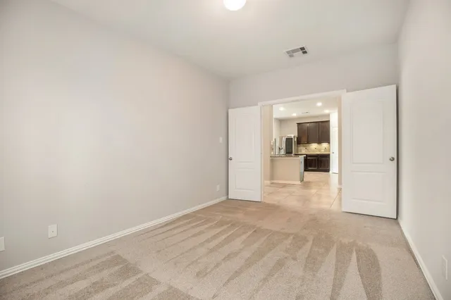 a view of a living room hardwood and kitchen view
