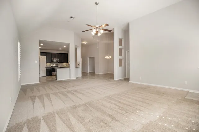 a view of a kitchen with a sink and a kitchen view