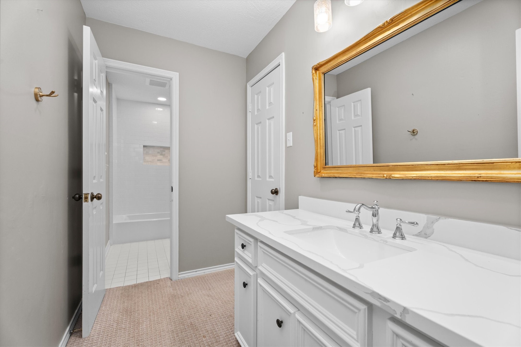 16267 Salmon Lane Spring, TX 77379 - Photo 31 of 48 The second sink area is similarly updated, with a walk-in closet to the right.