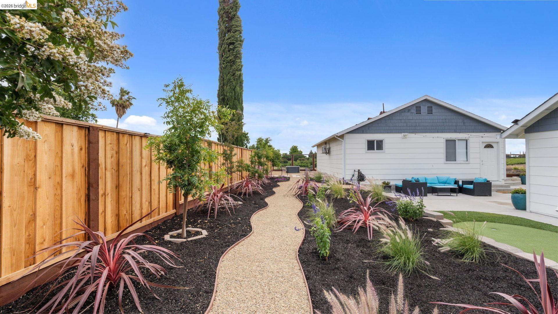 700 Brownstone Road Oakley, CA 94561 - Photo 39 of 58 Expansive outdoor space featuring a winding gravel pathway bordered by landscaped beds
