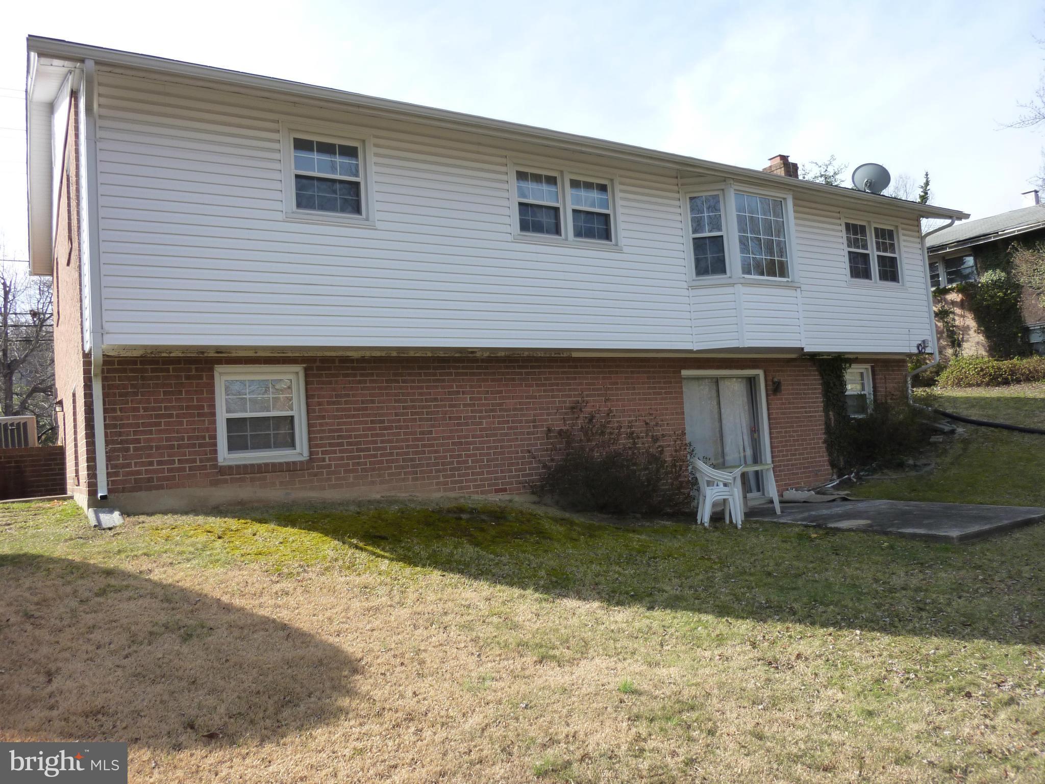 1936 Powder Mill Road Silver Spring, MD 20903 - Photo 2 of 4 a front view of a house with a yard