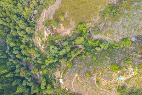 an aerial view of residential house with yard and outdoor space