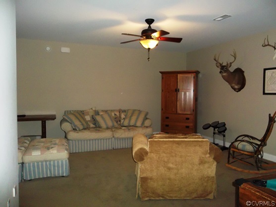 1928 Chinquapin Road Prospect, VA 23960 - Photo 11 of 24 a living room with furniture and a chandelier