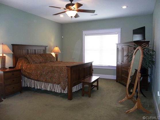 1928 Chinquapin Road Prospect, VA 23960 - Photo 17 of 24 a bedroom with a bed and a chandelier