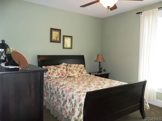1928 Chinquapin Road Prospect, VA 23960 - Photo 10 of 24 a bed sitting in a bedroom next to a window and a lamp