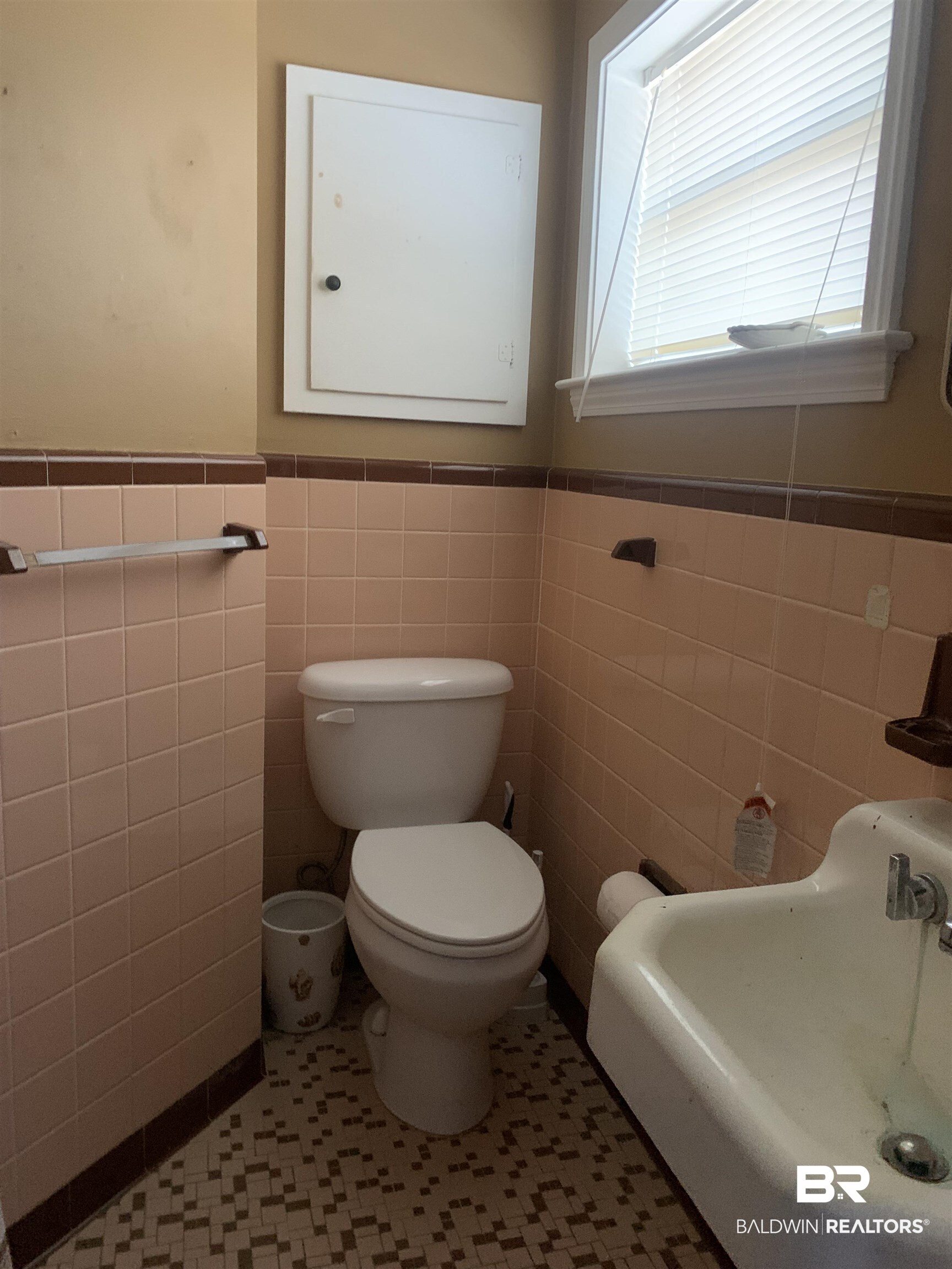5467 Racine Avenue Mobile, AL 36618 - Photo 8 of 11 Bathroom with tile walls, tile patterned flooring, and toilet