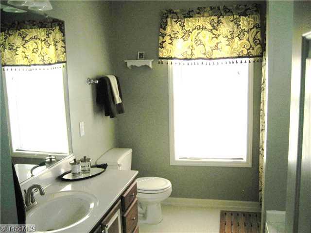 210 Stapleton Way High Point, NC 27265 - Photo 11 of 16 Master Bath/Spa. Features an oversized vanity, linen closet, garden tub, and separate shower.