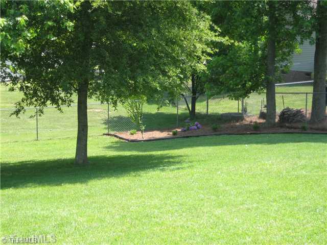 210 Stapleton Way High Point, NC 27265 - Photo 14 of 16 Exterior Back. Spacious, fenced backyard and landscaping.
