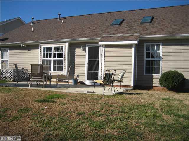 210 Stapleton Way High Point, NC 27265 - Photo 15 of 16 Exterior Back. Concrete patio, view of the new roof and skylights.