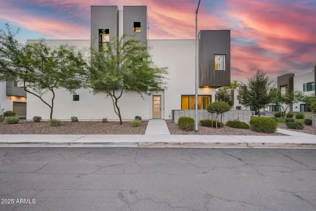 a view of street along with house and trees