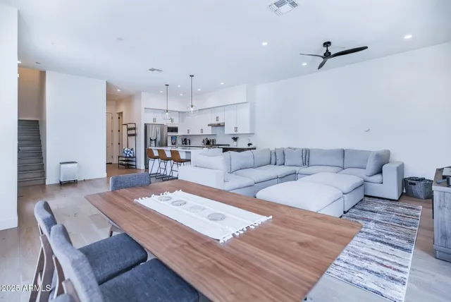 a living room with furniture and a rug