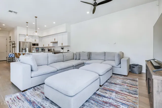 a living room with furniture and a rug