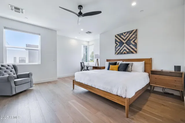 a bedroom with bed and window