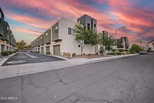 a view of a street with a building in the background