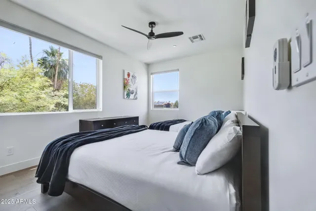 a bedroom with a bed and a window