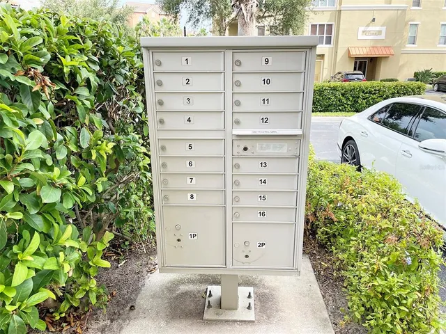 a view of a tall building next to a road