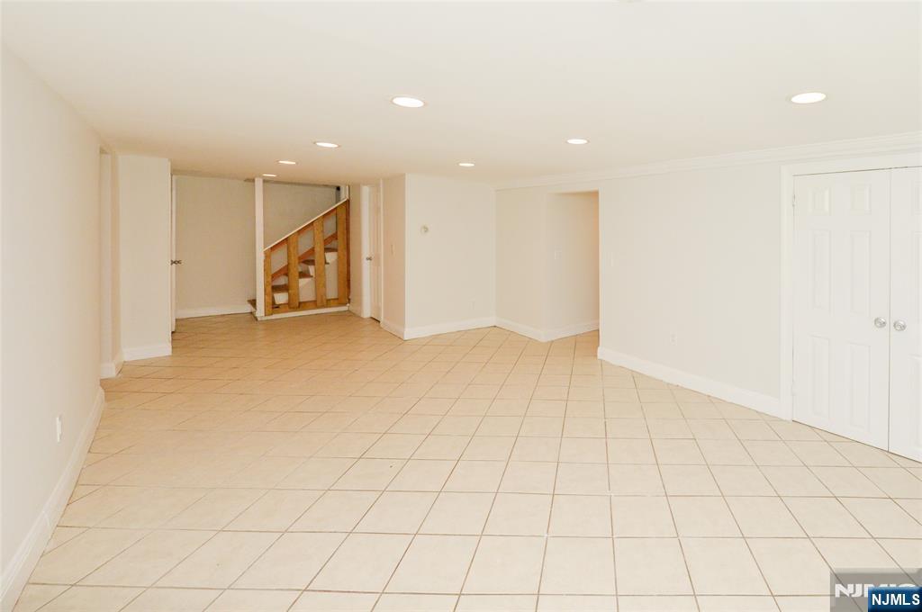 62 Broadway, Unit 1 Hackensack, NJ 07601 - Photo 16 of 25 an empty room with kitchen view and window