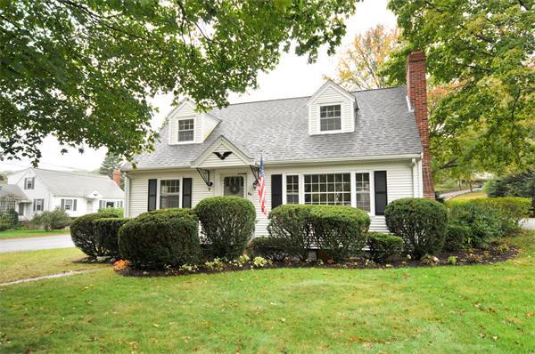 64 Stowecroft Road Arlington, MA 02474 - Photo 1 of 1 a front view of a house with a yard and potted plants