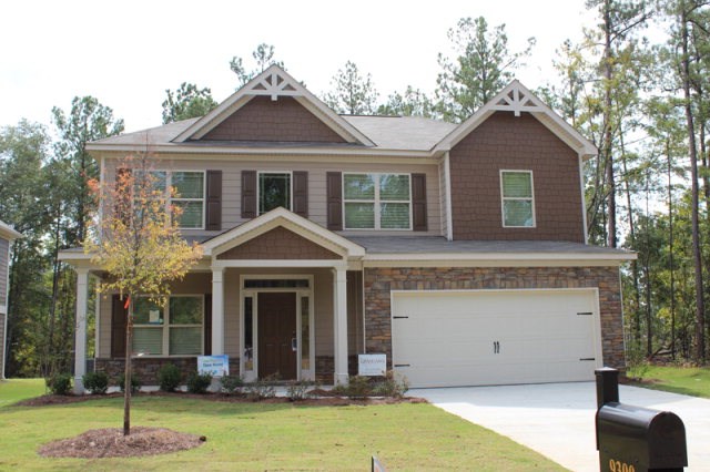 9300 Yarbrough Road Midland, GA 31820 - Photo 1 of 18 a front view of a house with a yard