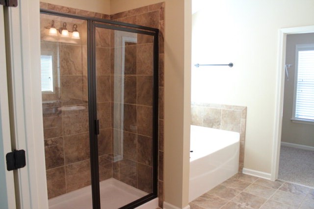 9300 Yarbrough Road Midland, GA 31820 - Photo 11 of 18 a bathroom with a glass shower door