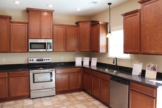 9300 Yarbrough Road Midland, GA 31820 - Photo 5 of 18 a kitchen with stainless steel appliances granite countertop a sink stove and microwave