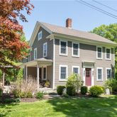 a front view of a house with a yard and porch