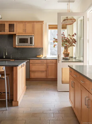 a kitchen with stainless steel appliances granite countertop a stove and a sink