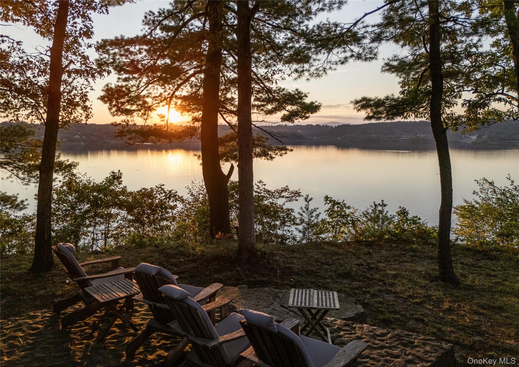 40 Morton Road Rhinebeck, NY 12572 - Photo 2 of 42 a view of a lake with lawn chairs