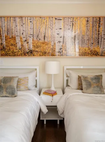 a bedroom with a bed and lamp