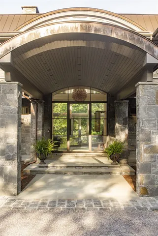 a swimming pool with an outdoor seating and yard