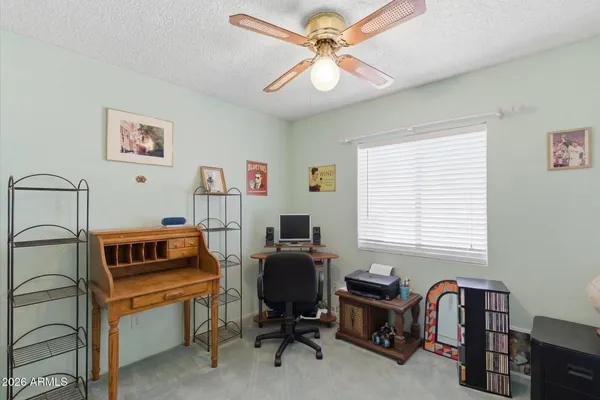 a bathroom with a sink a toilet and shower curtain