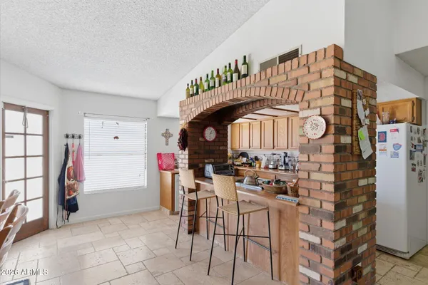 a kitchen with stainless steel appliances granite countertop a stove and a refrigerator