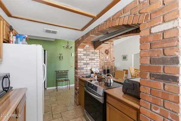 a bedroom with a bed and a baby crib