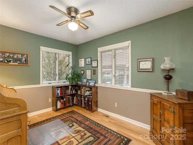 a view of a livingroom with furniture and a window
